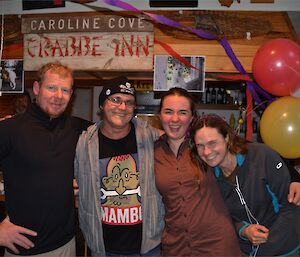 Mike, Barry, Leona and Ange enjoying the party. They are standing in front of the decorated bar