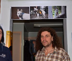 Birthday boy Billy with Aaron and pictures of his dogs (three pictures above the door entrance)