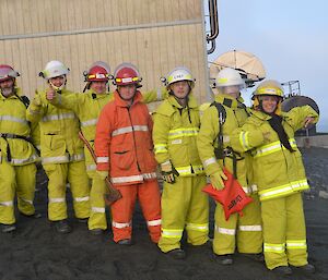 The fire team Patty, Lionel, Chef Tony, Josh, Aaron and Greg in there gear in a line