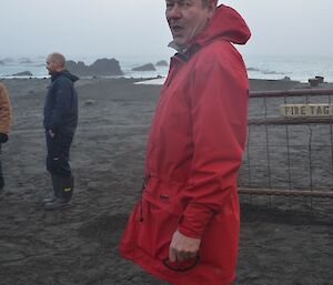 Dave standing in his red jacket