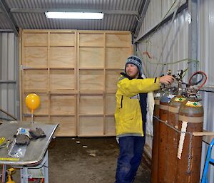 Aaron testing the helium gas flow in the temporary balloon release in the boat shed