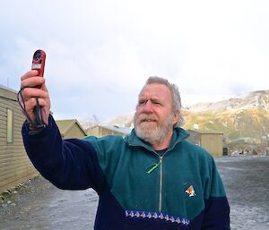 Nick checking his hand held weather instrument for ‘wind assistance'