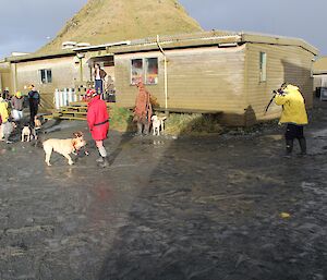 Barend (Barry), a photographer stands to one side of the mess taking photos of the trainers and their dogs