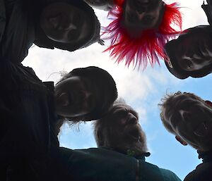 The New Zealand team huddle just before the first round — a silhouette of the faces of Nick, Leona, Ange, Steve, Tony H and Mike taken from below