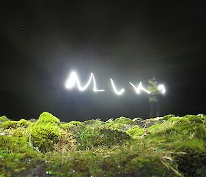 Mike exploring his artistic side — taken at night with long exposure shows Mike writing his name with a torch