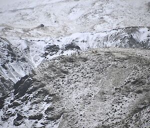 From afar, you can make out the Rescue team at the top of the snow covered steep slope beside Gadgets Gully