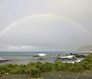 The sun came out for a brief time and gave us this — a full rainbow over the water from East Beach