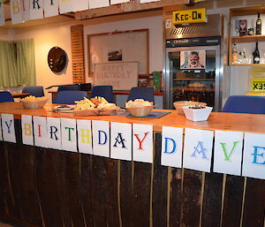 Celebrating Dave’s birthday — The Macca bar area adorned with decorations with a frieze of letters across the front edge of the bar spelling ‘Happy Birthday Dave!'