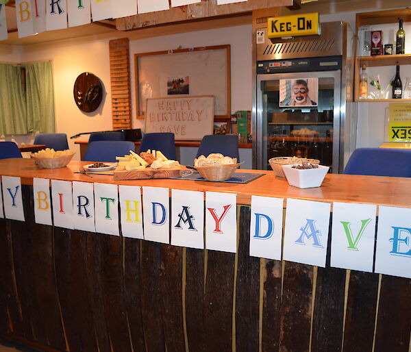 Celebrating Dave’s birthday — The Macca bar area adorned with decorations with a frieze of letters across the front edge of the bar spelling ‘Happy Birthday Dave!'