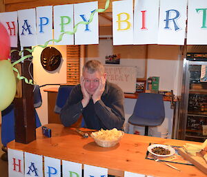 Dave sitting behind the decorated bar