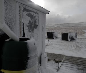 A snow blasted Eitel watertank hut looking north