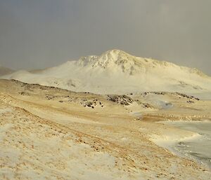 Mt Hamilton covered in deep snow, viewed from the north with a frozen Lake Tiobunga seen on the right