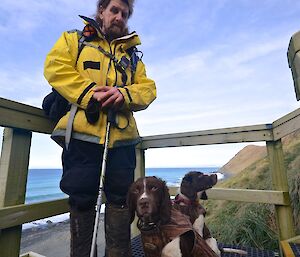 Billy with springer spaniels, Joker and Colin, resting on the steps to the lookout