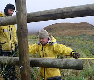 Dean and David measuring up a pole on the new elephant seal exclusion fence