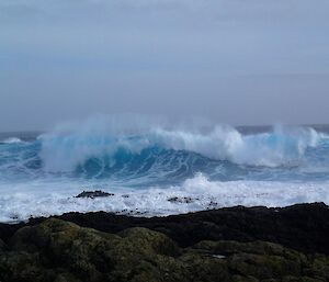 Surf at Caroline Cove, being windswept by an offshore breeze