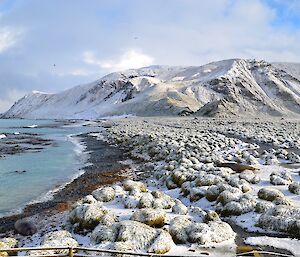 Same day and taken from the same location as the previous photo in the mid-afternoon. It is a view of the east coast, isthmus and the escarpment beyond, though this time everything is covered in a blanket of snow