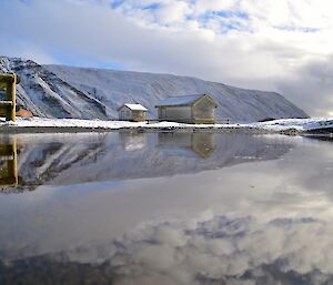 Mid-afternoon view of the magnetic quiet zone reflected in a small pond taken from the same place as the previous photo. This time the scene has a good covering of snow and cloud. Once again a almost perfect reflection in the pond