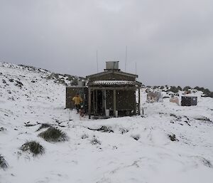 Bauer Bay hut surrounded by extensive deep snow