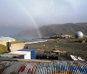 Rainbow from the station — with one end on the isthmus right over Greg in his yellow (gold) wet weather jacket