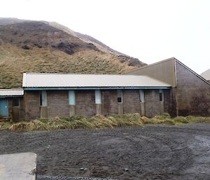 Hasselborough House (Hass House accommodation) the only brick building on Macca. Wireless Hill is in the background