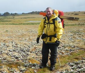 Dave loaded up with track markers, standing on the track on the featherbed