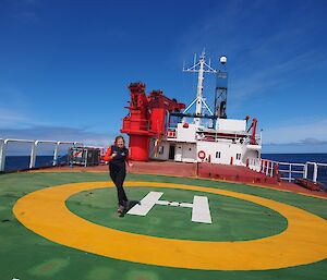 Jamie, walking on a slightly tilted helideck on L'Astrolabe enjoying the sunshine and calm conditions on a pleasant voyage