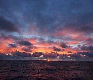 Sunset over a relatively calm sea