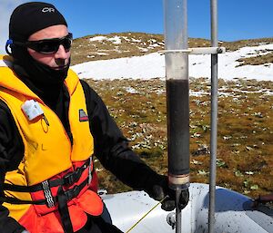 Dominic sits next to a vertical UWITEC surface core from the central point. The flocculent uppermost 12cm of this core most likely represents historical disturbance in the catchment associated with the introduction of non-native animals over the last century or so