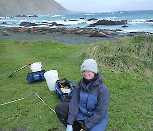 Ingrid carrying out field sampling at the south end of the western side of the isthmus. A large elephant seal harem on the beach as well as the waters of Hasselborough Bay and the escarpment provide a impressive backdrop