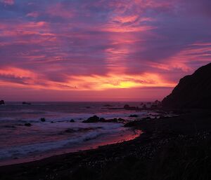 A spectacular sunset at Hurd Point with a silhouette of the beach and rugged coastal escarpment