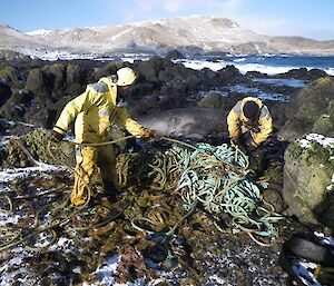 Barry and Chris untangling the huge pile of slime covered rope at the water’s edge. The snow covered hills south of Bauer Bay make a nice backdrop