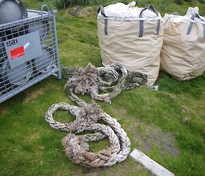 Large bulker bags containing marine debris awaiting chopper fly out at resupply. Also shown is some 100mm rope retrieved from a different site along the coast