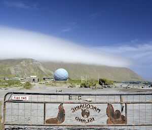 Amazing lenticular (orographic) that capped the island on Christmas day, taken from just behind the station gate (in the foreground) looking south across the isthmus and some of the station buildings