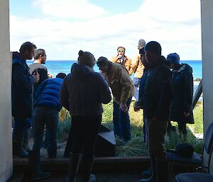 Australia Day — the view from the boat shed out towards the east. It shows ten of the expeditioners enjoying snacks and beverages.