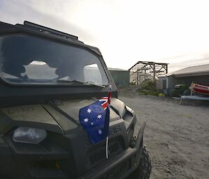 Australia Day — The polaris buggy outside the boat shed, ready to transport stuff back to the station. There is a small Australian flag attached to the front grill of the vehicle