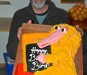 Greg with his birthday cake — in the shape of ‘Big Bird’ from Sesame Street holding a GPS