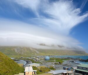 Orographic lenticular cap over the island on the 28th of January. The view is from a point halfway up the Wireless Hill track, across the station and isthmus then onto the escarpment which is covered in distinct layers of cloud