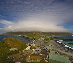 Orographic lenticular cap over the island on the 28th of January. The view is from the Golf Tee up on the Wireless Hill track, across the station and isthmus then onto the escarpment which is covered in distinct layers of cloud. This photo was taken a half hour later then the previous photo.