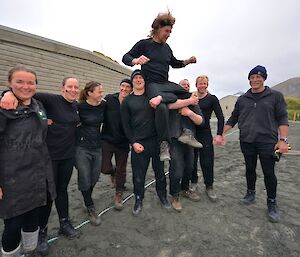 New Zealand team members Leona, Dana, Ange, Keith, Jack, Nick, Billy (on the shoulders of Jack and Nick), Mike and Pete celebrate their victory. They are in ‘all black’ uniform