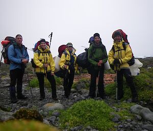 Hiking out the marine debris crew, Keith, Bianca, Vicki, Kris and Clive. Each is wearing a survival back pack loaded with extra marine debris