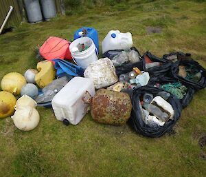On the grassy area beside Bauer bay hut is a huge pile of marine debris collected from two kilometres of coastline. It includes several plastic bags full of drink bottles, green string and other rubbish as well as several fishing floats, polystyrene, big plastic containers and a small gas cylinder