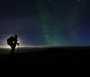 Spotlighting moments — this amazing images shows an aurora australis with a silhouette of MIPEP’s Lachlan in front of the moon on the left