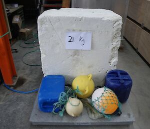On the scales in the Green Store, 21 kilograms of styrofoam and 10 kilograms of floats and buoys (five items)