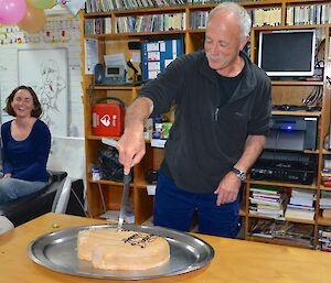 Stumpy (Peter) cutting the cake.