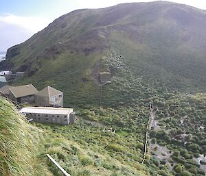 View of seismic building (the centre of the image) from the Ham Shack on Camp Hill. Some of the other station buildings are seen on the left side at the bottom of the hill