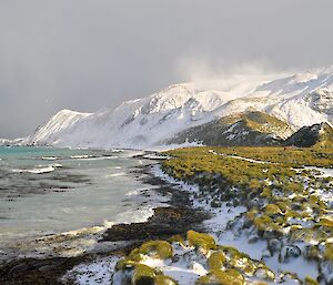 Winter scene of the east coast from the south end of station. Some snow can be seen blowing off the top of the escarpment