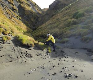 Josh checking the pipe at the bottom of Gadgets Gully in the sun