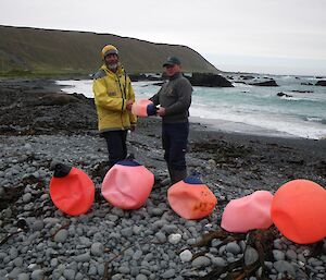 Chris making an honorary donation of a buoy to Greg on West Beach