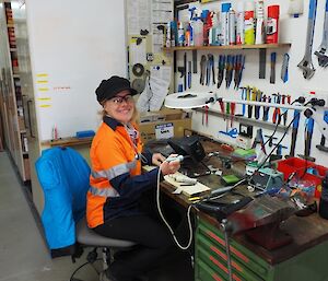 Remediation scientist, Lisa, fixing monitoring equipment in the workshop
