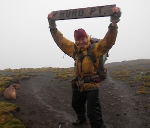 Rodent dog handler, Ange with the Hurd Point sign